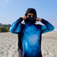 Angler 24-7 fishing shirt with cover face on beach.